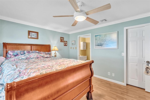 14898 Wildflower Ln Unit 0, Delray Beach, FL 33446 - bedroom featuring ornamental molding, light wood-style floors, baseboards, ensuite bath, and ceiling fan