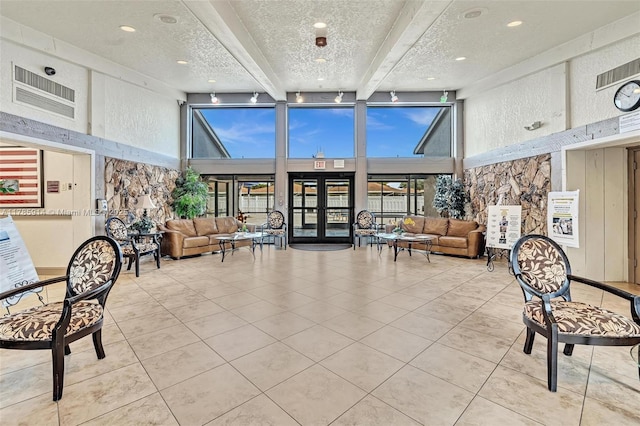 14898 Wildflower Ln Unit 0, Delray Beach, FL 33446 - lobby featuring a towering ceiling, beamed ceiling, and a textured ceiling