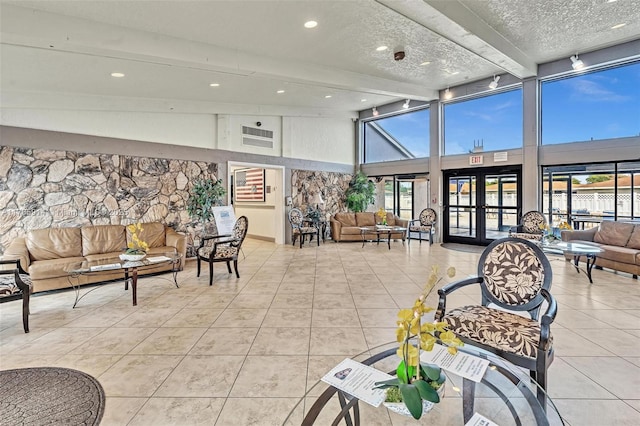 14898 Wildflower Ln Unit 0, Delray Beach, FL 33446 - common area featuring a towering ceiling, a textured ceiling, recessed lighting, and beam ceiling
