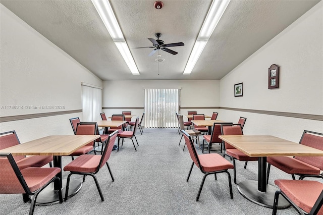 14898 Wildflower Ln Unit 0, Delray Beach, FL 33446 - dining area with a textured ceiling, ceiling fan, light colored carpet, and vaulted ceiling