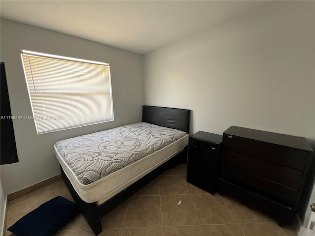 bedroom featuring tile patterned floors