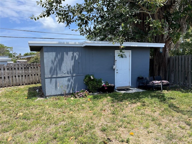 view of outbuilding with an outbuilding and fence