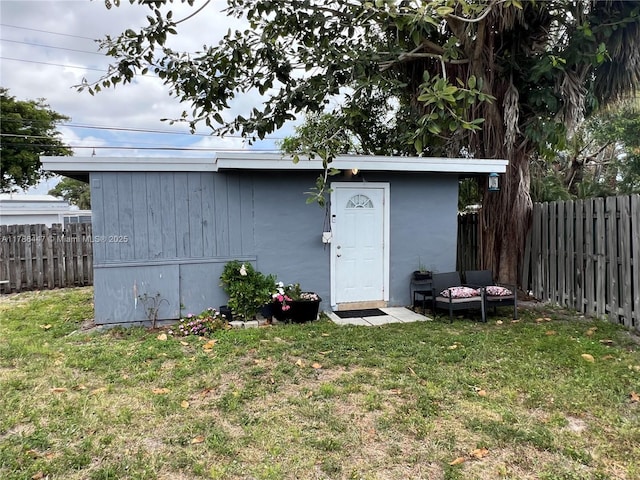 view of outbuilding with an outdoor structure and a fenced backyard