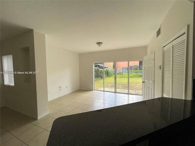 948 SW 6th Ct, Florida City, FL 33034 - spare room with baseboards, visible vents, and light tile patterned flooring