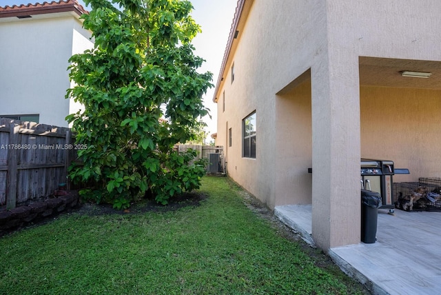 102 NE 23rd Ter, Homestead, FL 33033 - view of yard with central AC and a fenced backyard