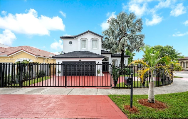 1733 SW 151st Pl, Miami, FL 33185 - mediterranean / spanish home featuring stucco siding, a fenced front yard, a tile roof, and decorative driveway