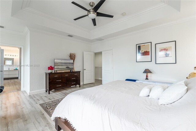 1733 SW 151st Pl, Miami, FL 33185 - bedroom featuring a tray ceiling, wood finished floors, ornamental molding, and a ceiling fan