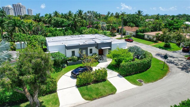 10603 NE 11th Ave, Miami Shores, FL 33138 - aerial view of property and surrounding area with a tree filled landscape