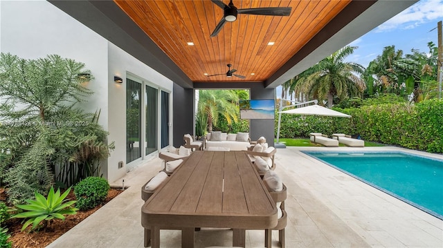 10603 NE 11th Ave, Miami Shores, FL 33138 - view of patio with ceiling fan, an outdoor pool, and outdoor dining area