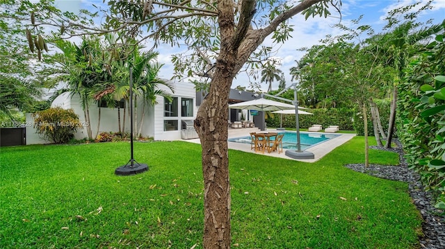 10603 NE 11th Ave, Miami Shores, FL 33138 - view of green lawn with a patio