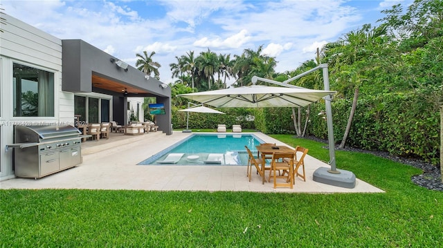 10603 NE 11th Ave, Miami Shores, FL 33138 - view of pool with a yard, a patio area, area for grilling, and ceiling fan