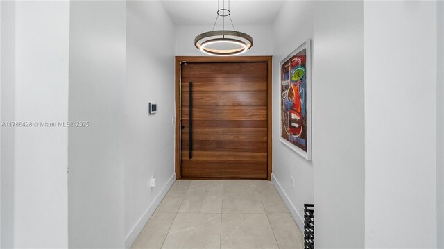 10603 NE 11th Ave, Miami Shores, FL 33138 - hallway with baseboards and light tile patterned floors
