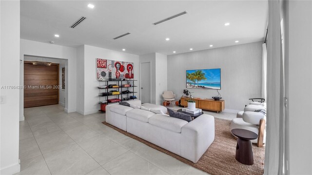 10603 NE 11th Ave, Miami Shores, FL 33138 - living room with recessed lighting, baseboards, and light tile patterned floors