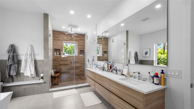 10603 NE 11th Ave, Miami Shores, FL 33138 - full bath featuring tile patterned floors, double vanity, recessed lighting, a shower stall, and plenty of natural light