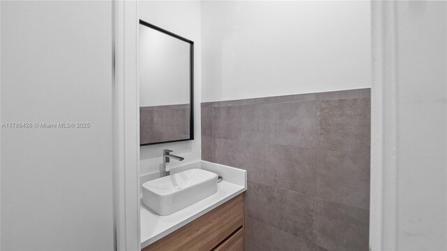 10603 NE 11th Ave, Miami Shores, FL 33138 - bathroom with vanity and tile walls