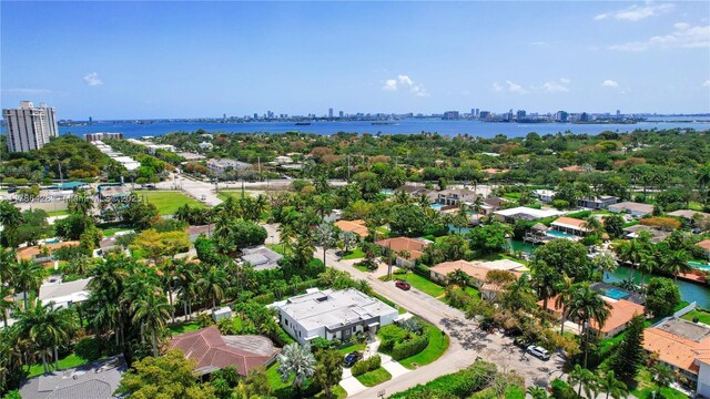 10603 NE 11th Ave, Miami Shores, FL 33138 - aerial view of residential area with city skyline and a large body of water
