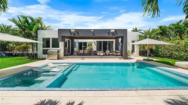 10603 NE 11th Ave, Miami Shores, FL 33138 - back of house featuring an outdoor kitchen, a patio, outdoor dining area, a ceiling fan, and stucco siding
