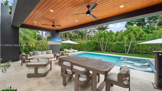 10603 NE 11th Ave, Miami Shores, FL 33138 - view of pool with ceiling fan, an outdoor hangout area, a patio area, a pool with connected hot tub, and outdoor dining area