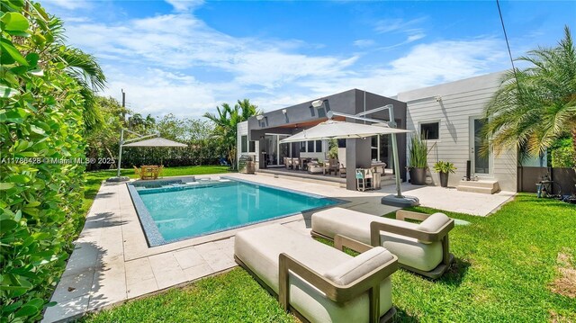 10603 NE 11th Ave, Miami Shores, FL 33138 - outdoor pool with an outdoor hangout area, a patio area, and a lawn