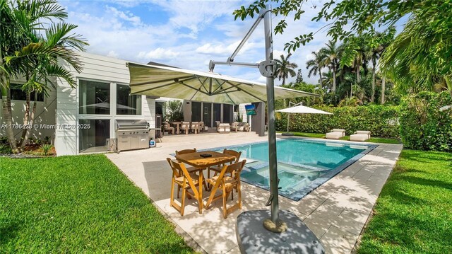 10603 NE 11th Ave, Miami Shores, FL 33138 - view of swimming pool with a yard, a grill, a patio, and a pool with connected hot tub