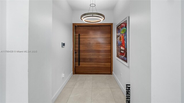 10603 NE 11th Ave, Miami Shores, FL 33138 - corridor with baseboards and light tile patterned floors