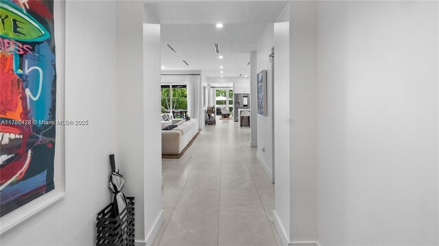 10603 NE 11th Ave, Miami Shores, FL 33138 - hallway featuring baseboards, light tile patterned flooring, and recessed lighting