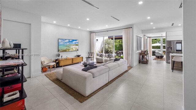 10603 NE 11th Ave, Miami Shores, FL 33138 - living area with recessed lighting and light tile patterned floors