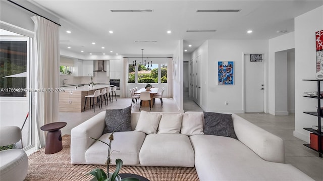 10603 NE 11th Ave, Miami Shores, FL 33138 - living room with recessed lighting and light tile patterned flooring