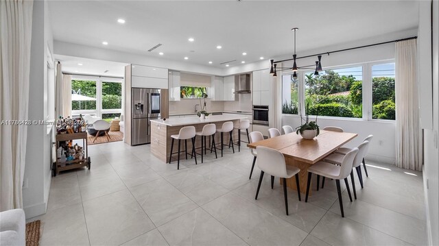 10603 NE 11th Ave, Miami Shores, FL 33138 - dining area with recessed lighting and light tile patterned floors