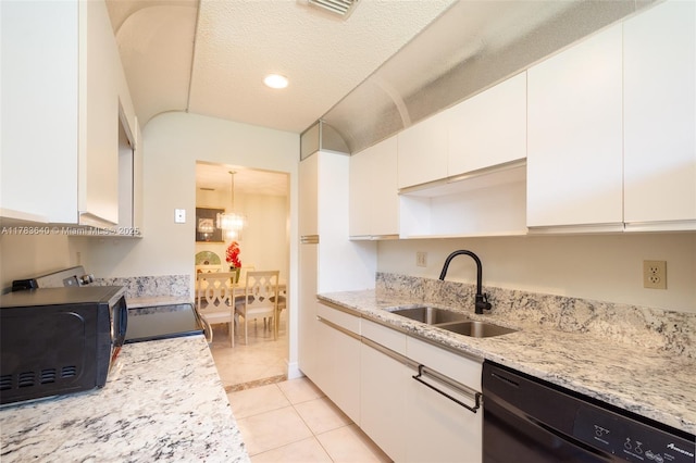13940 Nesting Way Unit C, Delray Beach, FL 33484 - kitchen featuring black appliances, white cabinets, a chandelier, light tile patterned floors, and light stone countertops