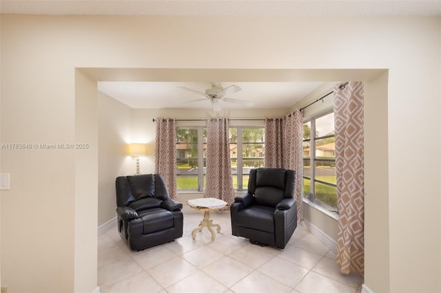 13940 Nesting Way Unit C, Delray Beach, FL 33484 - living area with ceiling fan and light tile patterned floors