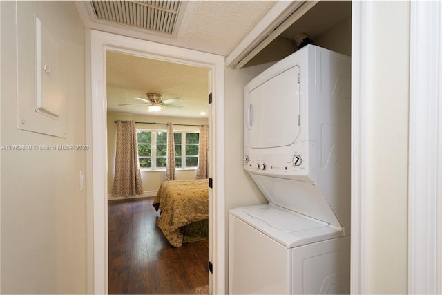 13940 Nesting Way Unit C, Delray Beach, FL 33484 - laundry area featuring stacked washing machine and dryer, a textured ceiling, hardwood / wood-style floors, and a ceiling fan