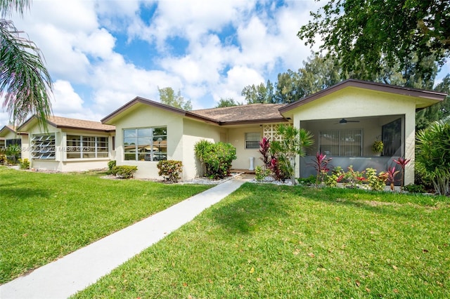 13940 Nesting Way Unit C, Delray Beach, FL 33484 - ranch-style house featuring ceiling fan, stucco siding, and a front lawn