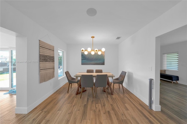 3953 SW 60th Ave, Miami, FL 33155 - dining space featuring wood finished floors, a chandelier, and baseboards