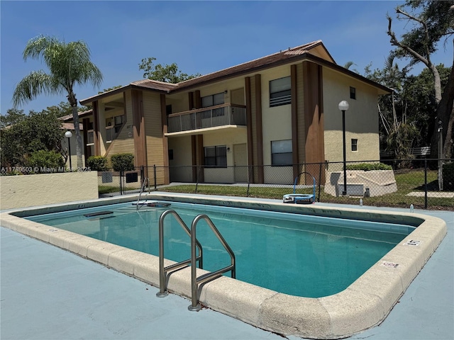 community pool with fence