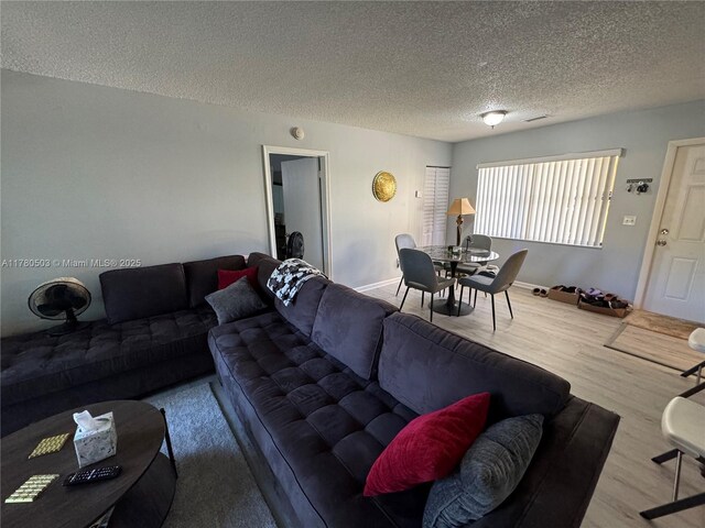 11329 Royal Palm Blvd Unit C-1, Coral Springs, FL 33065 - living room featuring a textured ceiling and wood finished floors