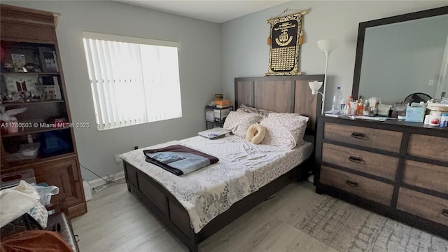 bedroom featuring light wood finished floors