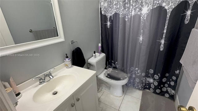 bathroom featuring toilet, tile patterned flooring, vanity, and a shower with curtain