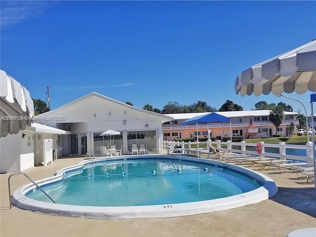 community pool with a patio area