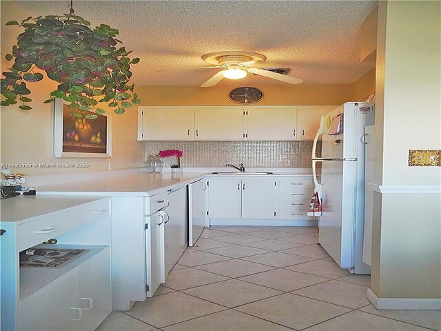 800 SW 11th Ave Unit 19A, Hallandale Beach, FL 33009 - kitchen featuring freestanding refrigerator, a sink, ceiling fan, light tile patterned floors, and a textured ceiling