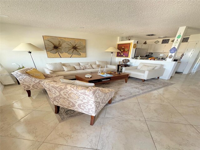 800 SW 11th Ave Unit 19A, Hallandale Beach, FL 33009 - living room with a textured ceiling