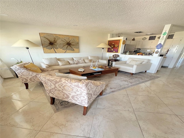 living room with a textured ceiling