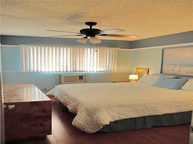 800 SW 11th Ave Unit 19A, Hallandale Beach, FL 33009 - bedroom with a wall unit AC, ceiling fan, and a textured ceiling