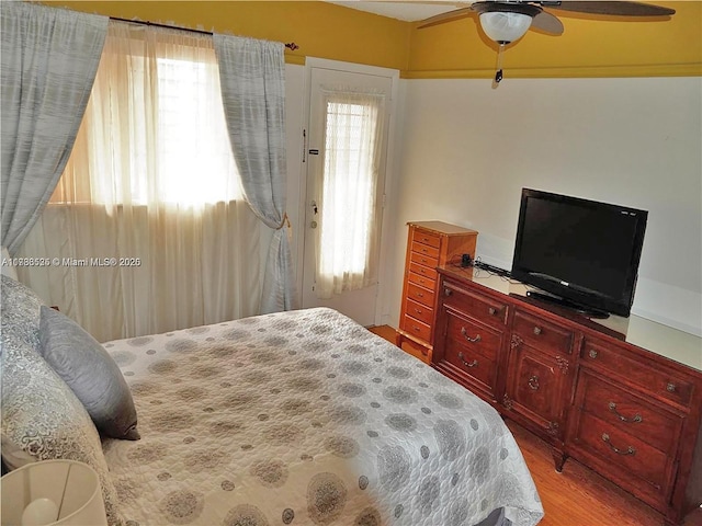 bedroom featuring ceiling fan and light wood-style flooring