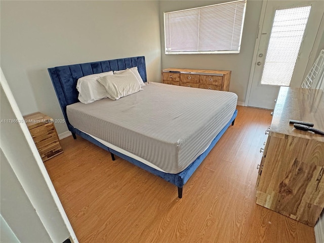 800 SW 11th Ave Unit 19A, Hallandale Beach, FL 33009 - bedroom featuring light wood finished floors and baseboards