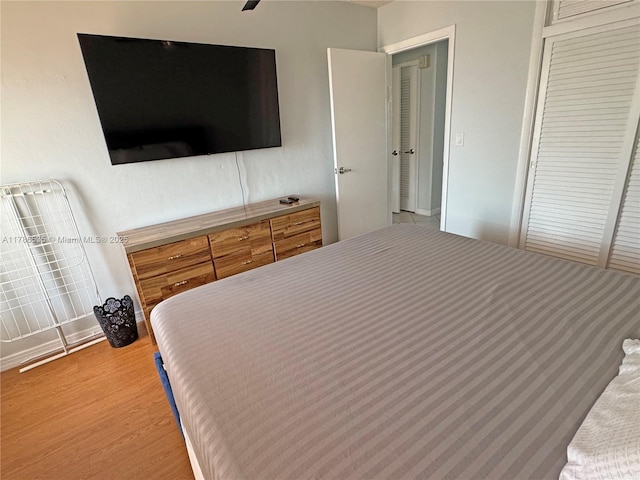 bedroom featuring light wood-style flooring