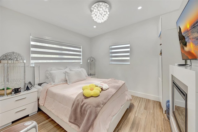 36355 SW 192nd Ave, Homestead, FL 33034 - bedroom with light wood-style flooring, baseboards, recessed lighting, and a notable chandelier