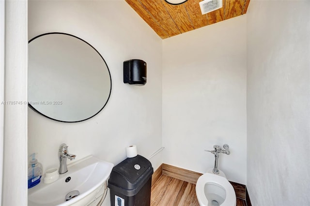 36355 SW 192nd Ave, Homestead, FL 33034 - half bath featuring wood finished floors, visible vents, toilet, wooden ceiling, and a sink