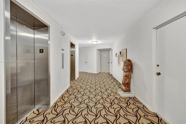 3000 Holiday Dr Unit 306, Fort Lauderdale, FL 33316 - hallway featuring elevator, carpet, and baseboards