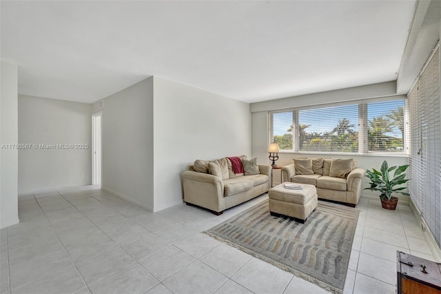 3000 Holiday Dr Unit 306, Fort Lauderdale, FL 33316 - living room featuring light tile patterned floors and baseboards
